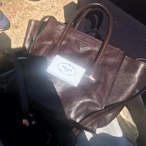 Prada handbag with long strap.